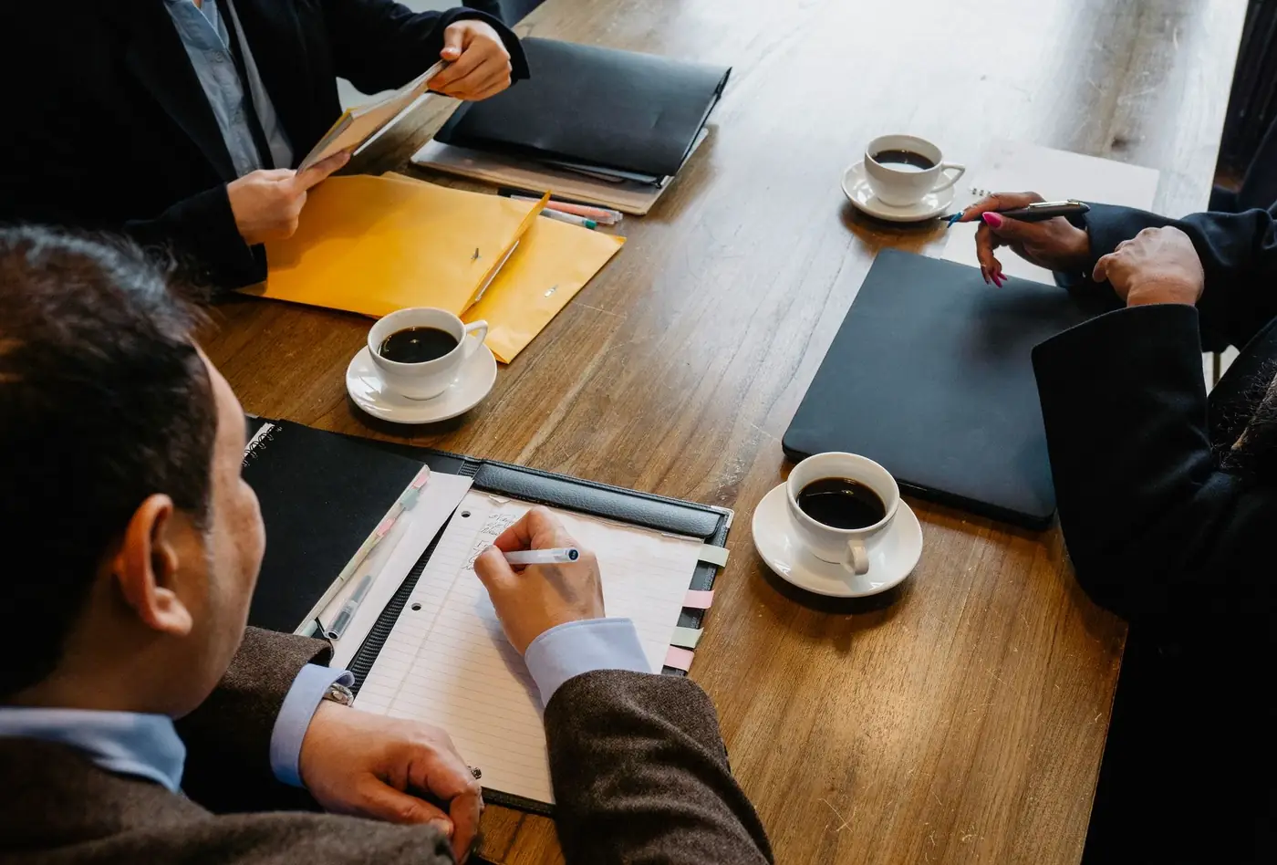 MOA Amendment in the UAE: Addendum to MOA 2 A business meeting with company documents on the table