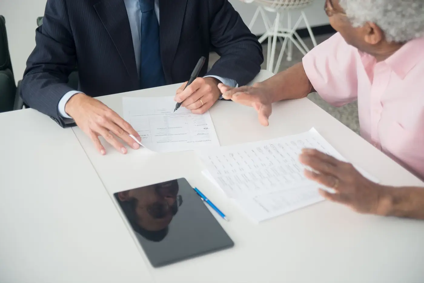 An advisor going through documents with a client